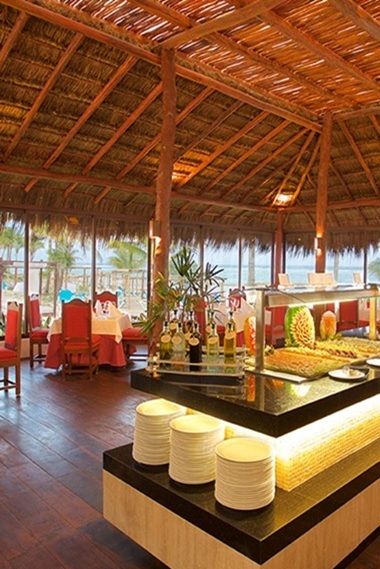 The Grill at Akumal Bay featuring premium grilled meats and outdoor dining