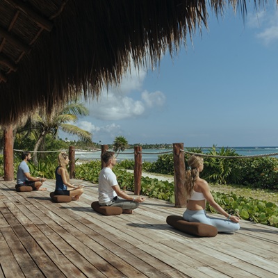 Yoga session on the beach at Akumal Bay Beach Spa Resort
