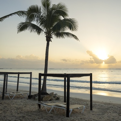 Turquoise Caribbean waters and private beachfront palapas